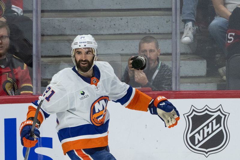 Oct 18, 2025; Ottawa, Ontario, CAN; New York Islanders center Kyle Palmieri (21) celebrates his goal scored in the third period against the Ottawa Senators at the Canadian Tire Centre. Mandatory Credit: Marc DesRosiers-IMAGN Images