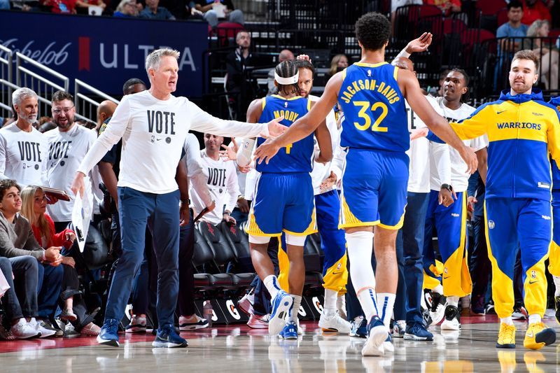 HOUSTON, TX - NOVEMBER 2:  Head Coach Steve Kerr and Trayce Jackson-Davis #32 of the Golden State Warriors high five during the game against the Houston Rockets on October 22, 2024 at the Toyota Center in Houston, Texas. NOTE TO USER: User expressly acknowledges and agrees that, by downloading and or using this photograph, User is consenting to the terms and conditions of the Getty Images License Agreement. Mandatory Copyright Notice: Copyright 2024 NBAE (Photo by Logan Riely/NBAE via Getty Images)