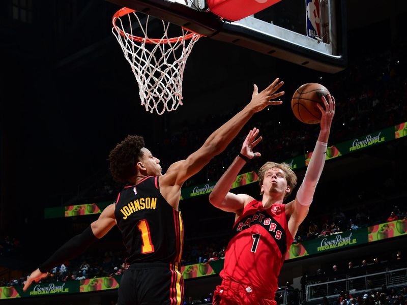 ATLANTA, GA - February 23: Gradey Dick #1 of the Toronto Raptors drives to the basket during the game as Jalen Johnson #1 of the Atlanta Hawks plays defense on February 23, 2024 at State Farm Arena in Atlanta, Georgia.  NOTE TO USER: User expressly acknowledges and agrees that, by downloading and/or using this Photograph, user is consenting to the terms and conditions of the Getty Images License Agreement. Mandatory Copyright Notice: Copyright 2024 NBAE (Photo by Scott Cunningham/NBAE via Getty Images)