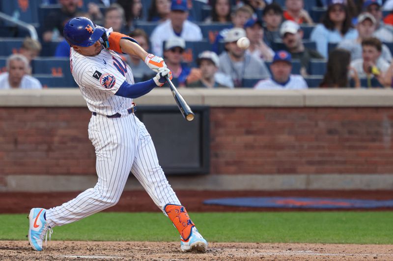 May 26, 2025; New York City, New York, USA; New York Mets center fielder Tyrone Taylor (15) hits a double during the ninth inning against the Chicago White Sox at Citi Field. Mandatory Credit: Vincent Carchietta-Imagn Images
