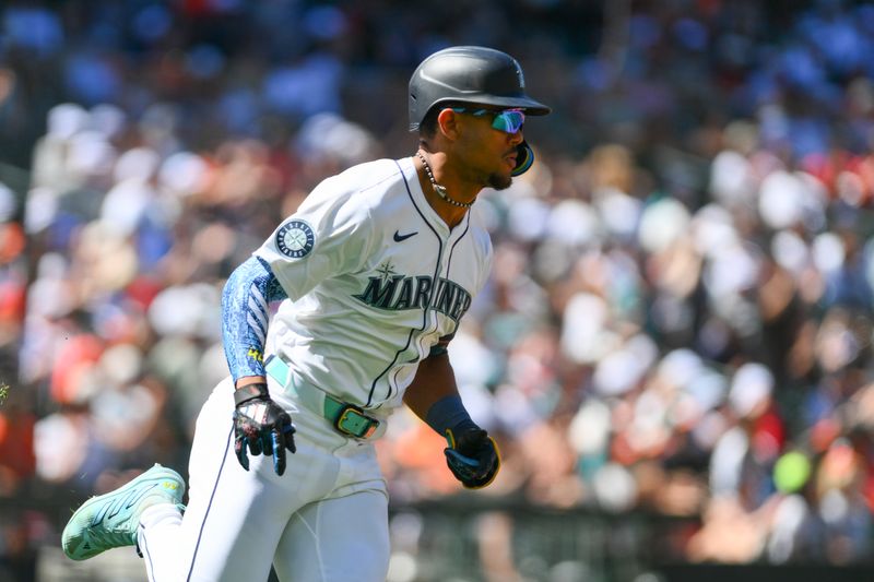 Jul 4, 2024; Seattle, Washington, USA; Seattle Mariners center fielder Julio Rodriguez (44) runs towards first base after hitting a double against the Baltimore Orioles during the seventh inning at T-Mobile Park. Mandatory Credit: Steven Bisig-USA TODAY Sports