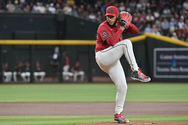 Apr 11, 2025; Phoenix, Arizona, USA; Arizona Diamondbacks pitcher Eduardo Rodriguez (57) throws in the first inning against the Milwaukee Brewers at Chase Field. Mandatory Credit: Matt Kartozian-Imagn Images
