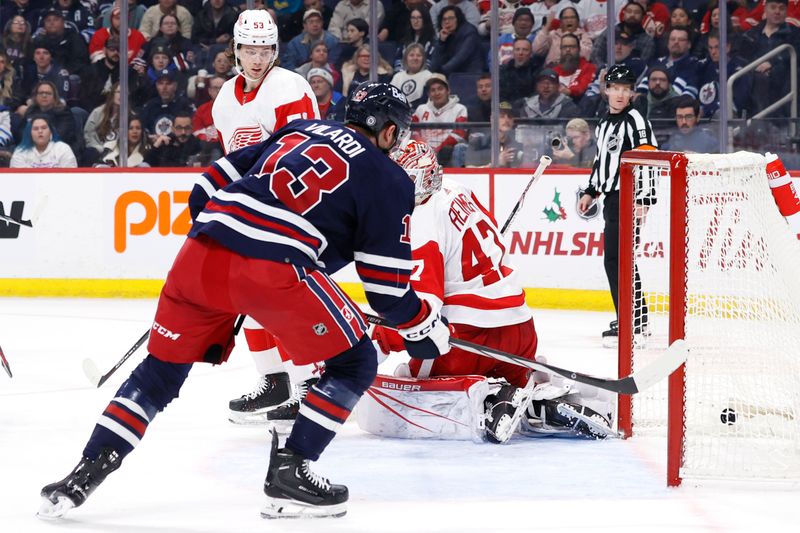 Dec 20, 2023; Winnipeg, Manitoba, CAN; Winnipeg Jets center Gabriel Vilardi (13) scores on Detroit Red Wings goaltender James Reimer (47) in the second period at Canada Life Centre. Mandatory Credit: James Carey Lauder-USA TODAY Sports