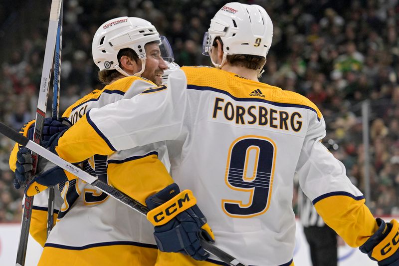 Jan 25, 2024; Saint Paul, Minnesota, USA; Nashville Predators defenseman Roman Josi (59) celebrates his goal against the Minnesota Wild with forward Filip Forsberg (9) during the third period at Xcel Energy Center. Mandatory Credit: Nick Wosika-USA TODAY Sports