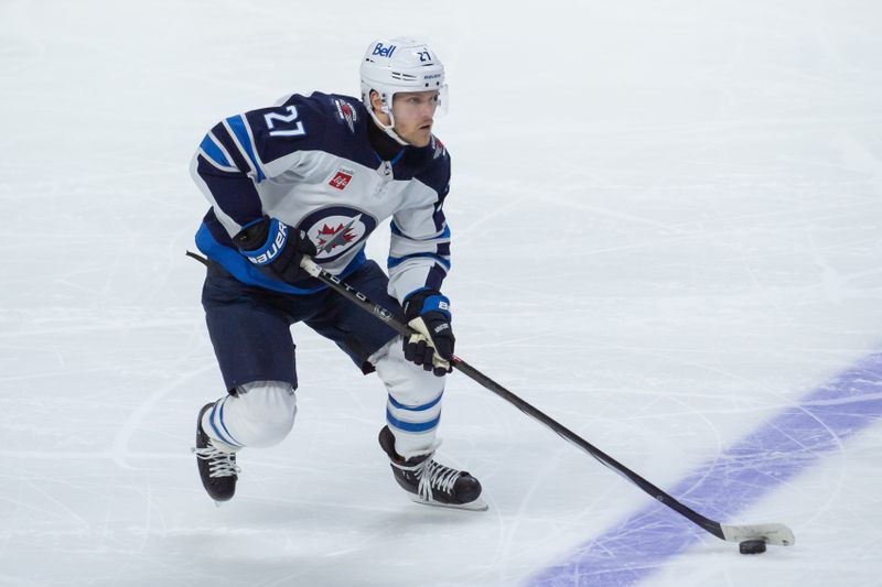 Jan 20, 2024; Ottawa, Ontario, CAN; Winnipeg Jets left wing Nikolaj Ehlers (27) skates with the puck in the third period against the Ottawa Senators at the Canadian Tire Centre. Mandatory Credit: Marc DesRosiers-USA TODAY Sports