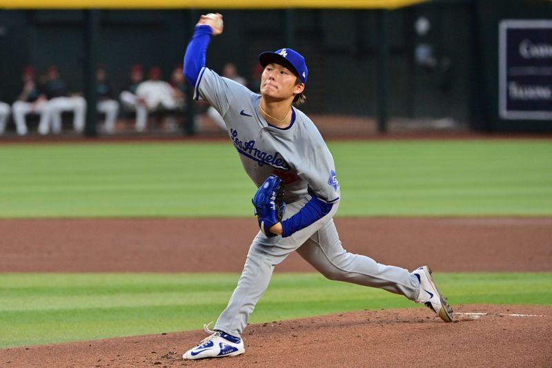 May 1, 2024; Phoenix, Arizona, USA;  Los Angeles Dodgers pitcher Yoshinobu Yamamoto (18) throws in the first inning against the Arizona Diamondbacks at Chase Field. Mandatory Credit: Matt Kartozian-USA TODAY Sports