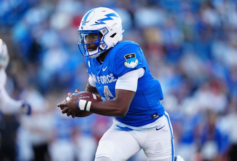 Sep 23, 2022; Colorado Springs, Colorado, USA; Air Force Falcons quarterback Haaziq Daniels (4) carries the ball in the first quarter against the Nevada Wolf Pack at Falcon Stadium. Mandatory Credit: Ron Chenoy-USA TODAY Sports