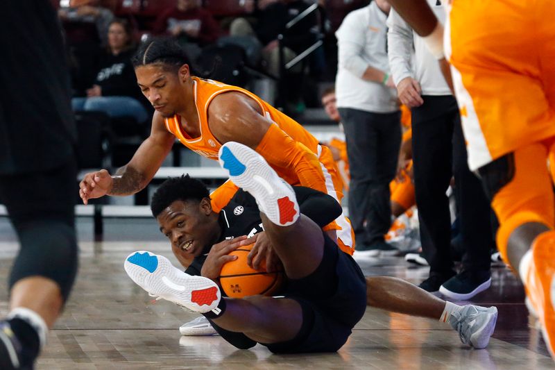 Jan 17, 2023; Starkville, Mississippi, USA; Mississippi State Bulldogs guard Dashawn Davis (10) steals the ball from Tennessee Volunteers guard Zakai Zeigler (5) during the first half at Humphrey Coliseum. Mandatory Credit: Petre Thomas-USA TODAY Sports