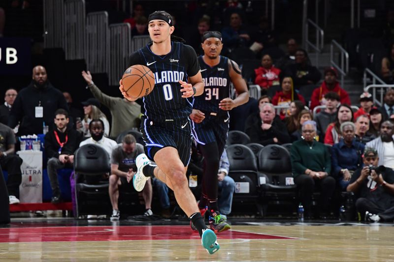 ATLANTA, GA - FEBRUARY 25: Anthony Black #0 of the Orlando Magic dribbles the ball during the game against the Atlanta Hawks on February 25, 2024 at State Farm Arena in Atlanta, Georgia.  NOTE TO USER: User expressly acknowledges and agrees that, by downloading and/or using this Photograph, user is consenting to the terms and conditions of the Getty Images License Agreement. Mandatory Copyright Notice: Copyright 2024 NBAE (Photo by Scott Cunningham/NBAE via Getty Images)