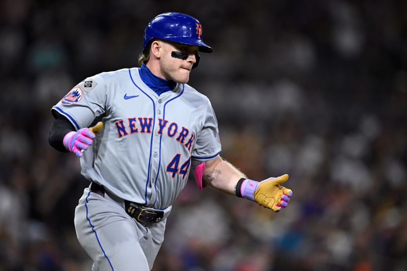 Aug 24, 2024; San Diego, California, USA; New York Mets center fielder Harrison Bader (44) celebrates while rounding the bases after hitting a home run against the San Diego Padres during the eighth inning at Petco Park. Mandatory Credit: Orlando Ramirez-USA TODAY Sports