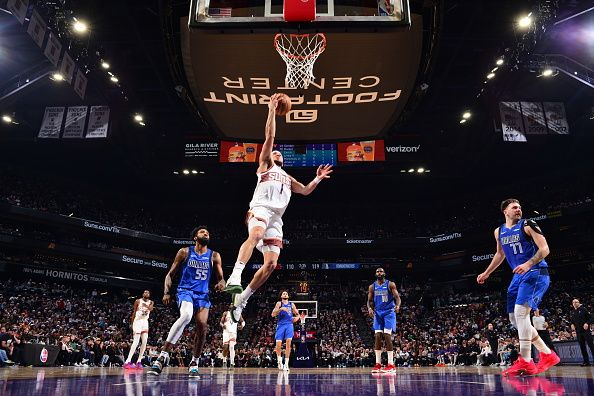 PHOENIX, AZ - DECEMBER 25: Devin Booker #1 of the Phoenix Suns shoots the ball during the game against the Dallas Mavericks on December 25, 2023 at Footprint Center in Phoenix, Arizona. NOTE TO USER: User expressly acknowledges and agrees that, by downloading and or using this photograph, user is consenting to the terms and conditions of the Getty Images License Agreement. Mandatory Copyright Notice: Copyright 2023 NBAE (Photo by Barry Gossage/NBAE via Getty Images)