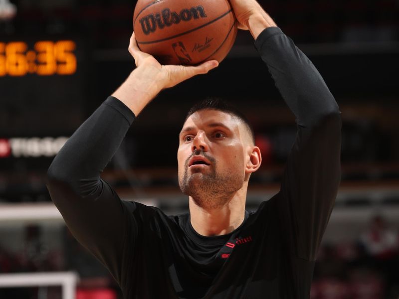 CHICAGO, IL - NOVEMBER 4: Nikola Vucevic #9 of the Chicago Bulls warms up before the game against the Utah Jazz on NOVEMBER 4, 2024 at United Center in Chicago, Illinois. NOTE TO USER: User expressly acknowledges and agrees that, by downloading and or using this photograph, User is consenting to the terms and conditions of the Getty Images License Agreement. Mandatory Copyright Notice: Copyright 2024 NBAE (Photo by Gary Dineen/NBAE via Getty Images)