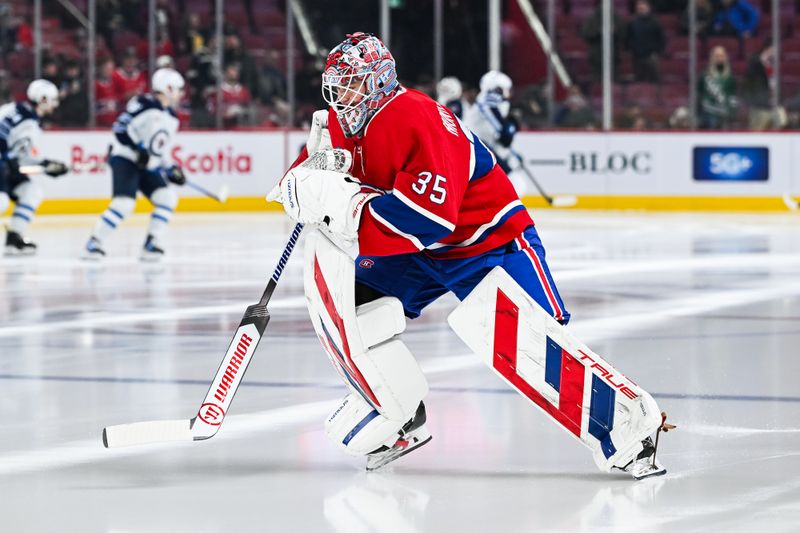 Jan 28, 2025; Montreal, Quebec, CAN; Montreal Canadiens goalie Sam Montembeault (35) skates during warm-up before the game against the Winnipeg Jets at Bell Centre. Mandatory Credit: David Kirouac-Imagn Images