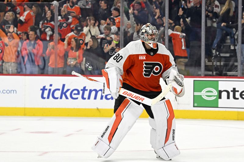 Oct 18, 2025; Philadelphia, Pennsylvania, USA; Philadelphia Flyers goaltender Dan Vladar (80) celebrates win against the Minnesota Wild in overtime at Wells Fargo Center. Mandatory Credit: Eric Hartline-Imagn Images