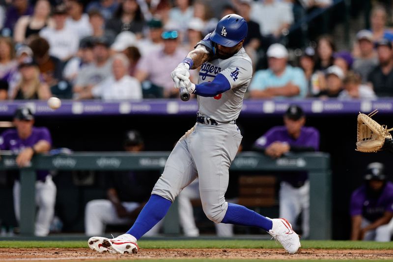 Jun 17, 2024; Denver, Colorado, USA; Los Angeles Dodgers right fielder Jason Heyward (23) hits a single in the seventh inning against the Colorado Rockies at Coors Field. Mandatory Credit: Isaiah J. Downing-USA TODAY Sports