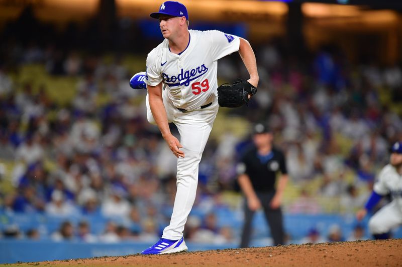 Aug 19, 2024; Los Angeles, California, USA; Los Angeles Dodgers pitcher Evan Phillips (59) throws against the Seattle Mariners during the ninth inning at Dodger Stadium. Mandatory Credit: Gary A. Vasquez-USA TODAY Sports