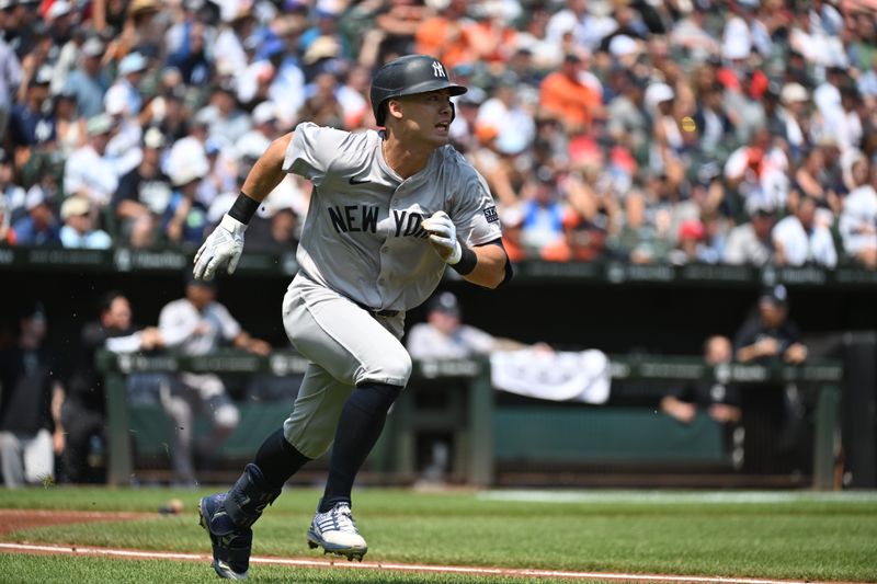 Jul 14, 2024; Baltimore, Maryland, USA;  New York Yankees shortstop Anthony Volpe (11) doubles during the second inning against the Baltimore Orioles at Oriole Park at Camden Yards. Mandatory Credit: James A. Pittman-USA TODAY Sports