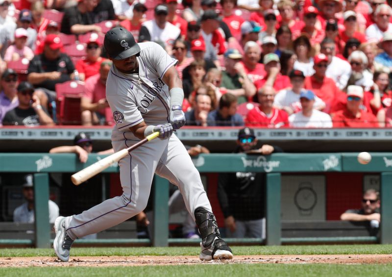 Jun 21, 2023; Cincinnati, Ohio, USA; Colorado Rockies first baseman Elehuris Montero (44) hits a solo home run against the Cincinnati Reds during the second inning at Great American Ball Park. Mandatory Credit: David Kohl-USA TODAY Sports