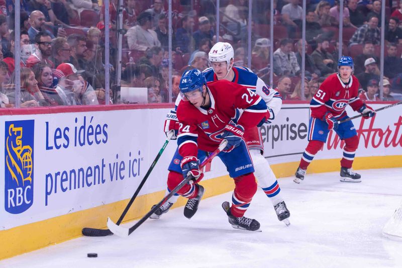 Oct 22, 2024; Ottawa, Ontario, CAN; Montreal Canadiens defenseman Logan Mailloux (24) skates with the puck in front of New York Rangers center Adam Edstrom (84) in the third period at the Bell Centre. Mandatory Credit: Marc DesRosiers-Imagn Images