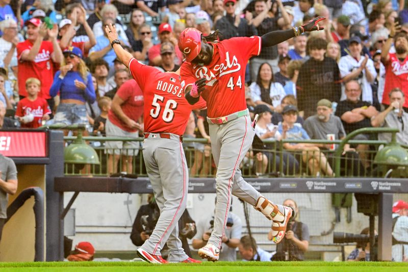 Sep 28, 2025; Milwaukee, Wisconsin, USA;  Cincinnati Reds shortstop Elly De La Cruz (44) is greeted by third base coach J.R. House after hitting a solo home run in the second inning against the Milwaukee Brewers at American Family Field. Mandatory Credit: Benny Sieu-Imagn Images
