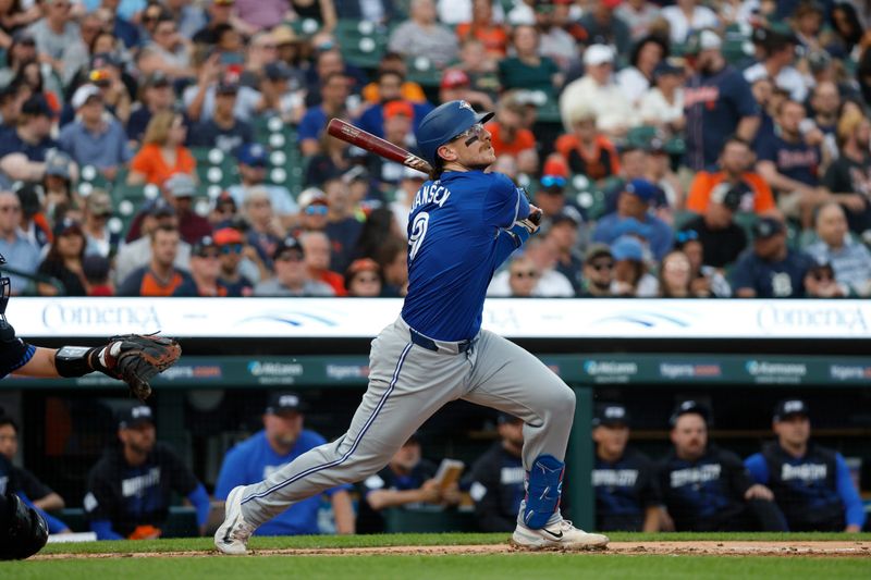 May 24, 2024; Detroit, Michigan, USA; Toronto Blue Jays catcher Danny Jansen (9) looks on after hitting a fly ball in the second inning of the game against the Detroit Tigers at Comerica Park. Mandatory Credit: Brian Bradshaw Sevald-USA TODAY Sports