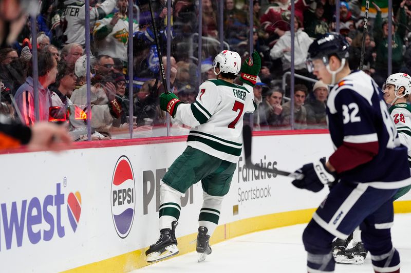 Jan 20, 2025; Denver, Colorado, USA; Minnesota Wild defenseman Brock Faber (7) celebrates his goal in the third period against the Colorado Avalanche at Ball Arena. Mandatory Credit: Ron Chenoy-Imagn Images