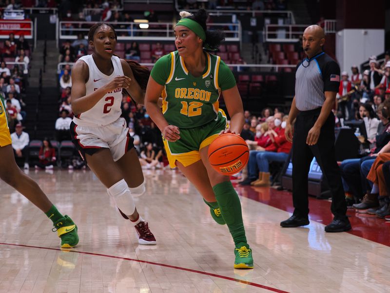 Jan 29, 2023; Stanford, California, USA; Oregon Ducks guard Te-Hina Paopao (12) controls the ball against Stanford Cardinal guard Agnes Emma-Nnopu (2) during the first quarter at Maples Pavilion. Mandatory Credit: Kelley L Cox-USA TODAY Sports