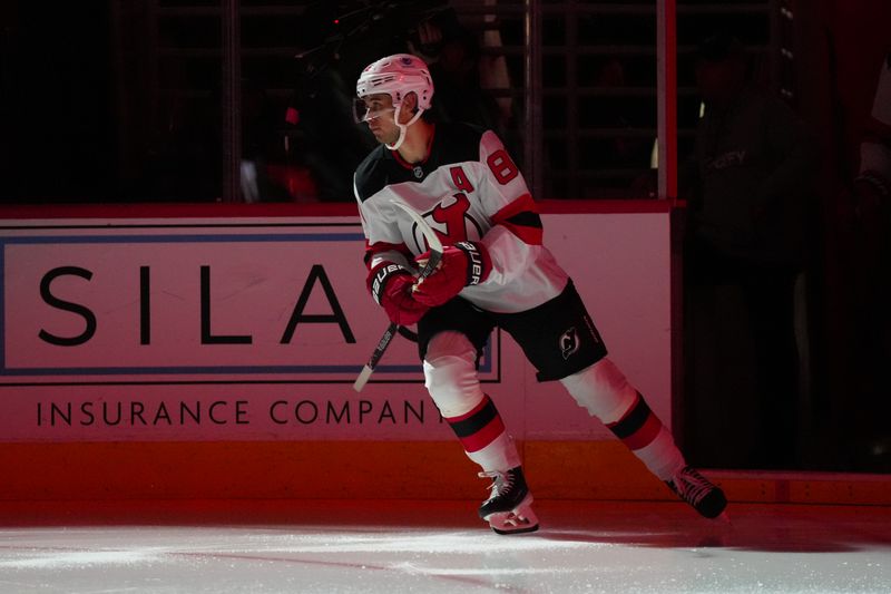 Oct 9, 2025; Raleigh, North Carolina, USA;  New Jersey Devils center Jack Hughes (86) skates out onto the ice before the game against the New Jersey Devils at Lenovo Center. Mandatory Credit: James Guillory-Imagn Images