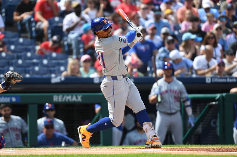 Sep 15, 2024; Philadelphia, Pennsylvania, USA; New York Mets shortstop Francisco Lindor (21) takes a swing during the first inning against the Philadelphia Phillies at Citizens Bank  Park. He would leave the game with an injury. Mandatory Credit: Eric Hartline-Imagn Images