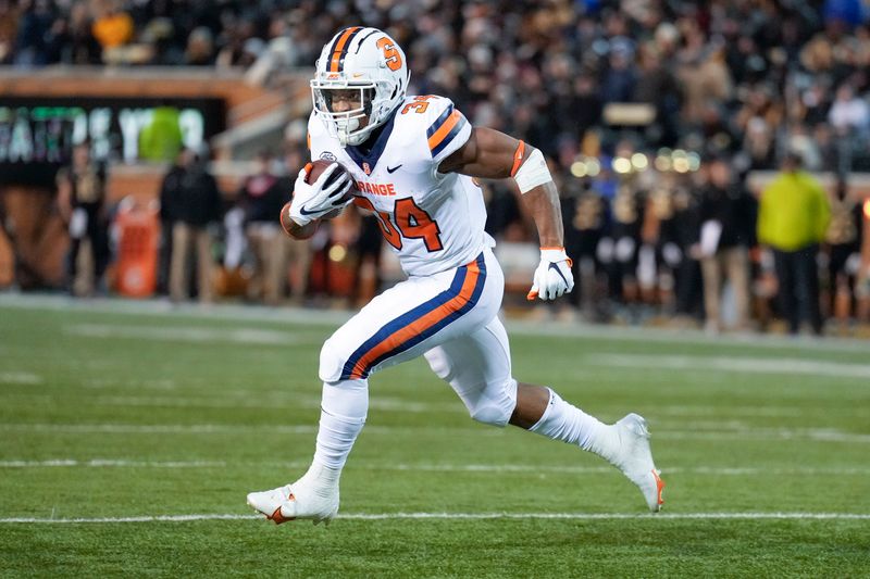 Nov 19, 2022; Winston-Salem, North Carolina, USA;  Syracuse Orange running back Sean Tucker (34) runs around end towards the end zone against the Wake Forest Demon Deacons during the first half at Truist Field. Mandatory Credit: Jim Dedmon-USA TODAY Sports