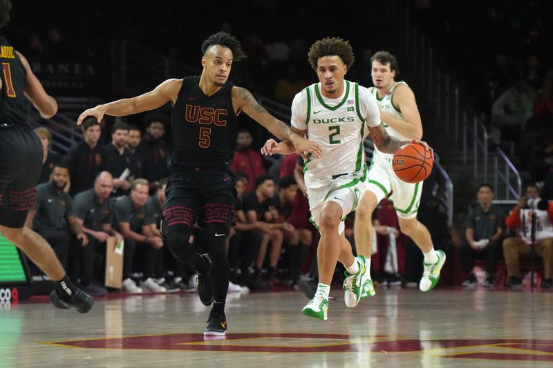 Dec 4, 2024; Los Angeles, California, USA;  Oregon Ducks guard Jadrian Tracey (2) dribbles against Southern California Trojans forward Terrance Williams II (5) in the second half at Galen Center. Mandatory Credit: Kirby Lee-Imagn ImagesDec 4, 2024; Los Angeles, California, USA; at Galen Center. Mandatory Credit: Kirby Lee-Imagn Images