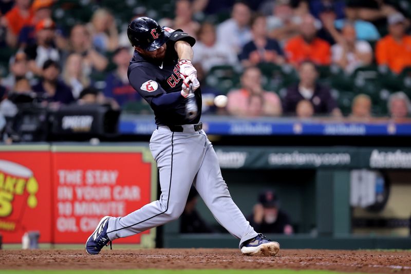 Apr 30, 2024; Houston, Texas, USA; Cleveland Guardians first base David Fry (6) hits an RBI single against the Houston Astros during the tenth inning at Minute Maid Park. Mandatory Credit: Erik Williams-USA TODAY Sports