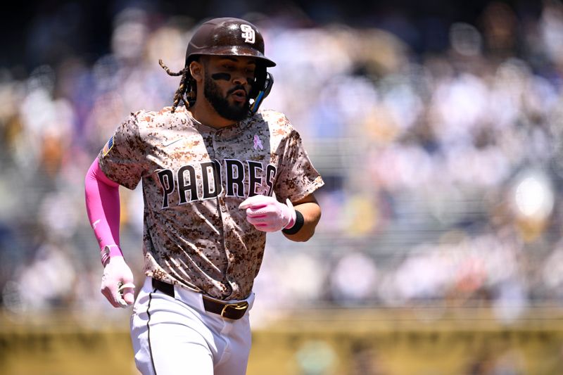 May 12, 2024; San Diego, California, USA; San Diego Padres right fielder Fernando Tatis Jr. (23) rounds the bases after hitting a home run against the Los Angeles Dodgers during the first inning at Petco Park. Mandatory Credit: Orlando Ramirez-USA TODAY Sports