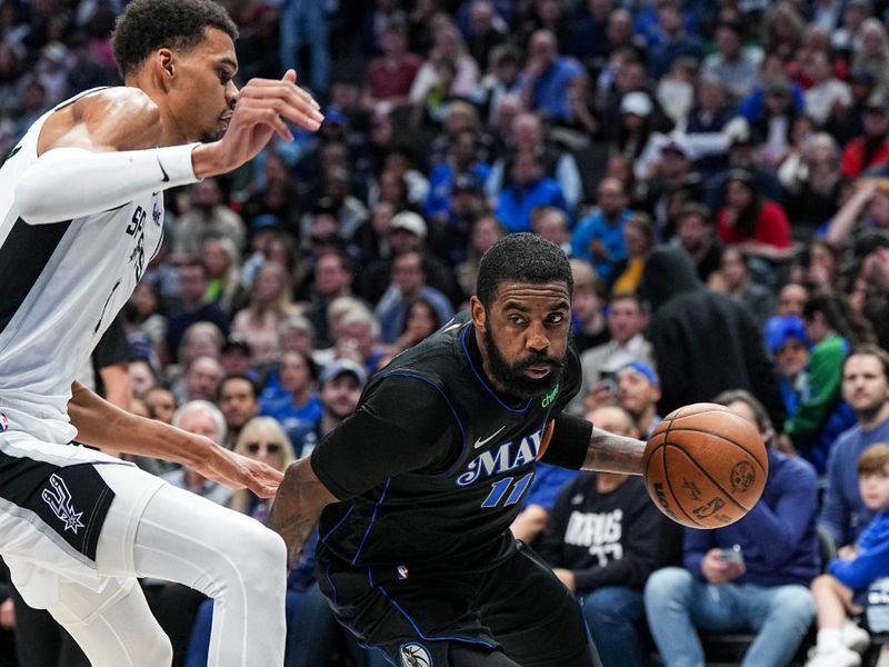 DALLAS, TX - FEBRUARY 14: Kyrie Irving #11 of the Dallas Mavericks drives to the basket during the game against the San Antonio Spurs on February 14, 2024 at the American Airlines Center in Dallas, Texas. NOTE TO USER: User expressly acknowledges and agrees that, by downloading and or using this photograph, User is consenting to the terms and conditions of the Getty Images License Agreement. Mandatory Copyright Notice: Copyright 2024 NBAE (Photo by Glenn James/NBAE via Getty Images)