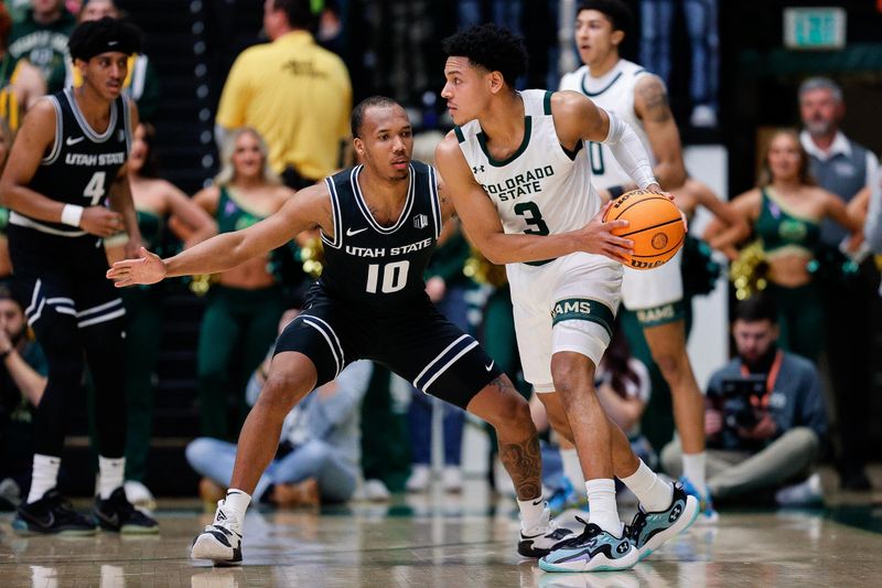 Feb 17, 2024; Fort Collins, Colorado, USA; Colorado State Rams guard Josiah Strong (3) controls the ball against Utah State Aggies guard Darius Brown II (10) in the first half at Moby Arena. Mandatory Credit: Isaiah J. Downing-USA TODAY Sports