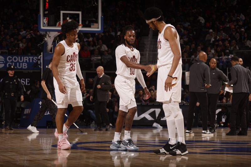 DETROIT, MI - MARCH 1: Darius Garland #10 high fives Jarrett Allen #31 of the Cleveland Cavaliers during the game against the Detroit Pistons on March 1, 2024 at Little Caesars Arena in Detroit, Michigan. NOTE TO USER: User expressly acknowledges and agrees that, by downloading and/or using this photograph, User is consenting to the terms and conditions of the Getty Images License Agreement. Mandatory Copyright Notice: Copyright 2024 NBAE (Photo by Brian Sevald/NBAE via Getty Images)