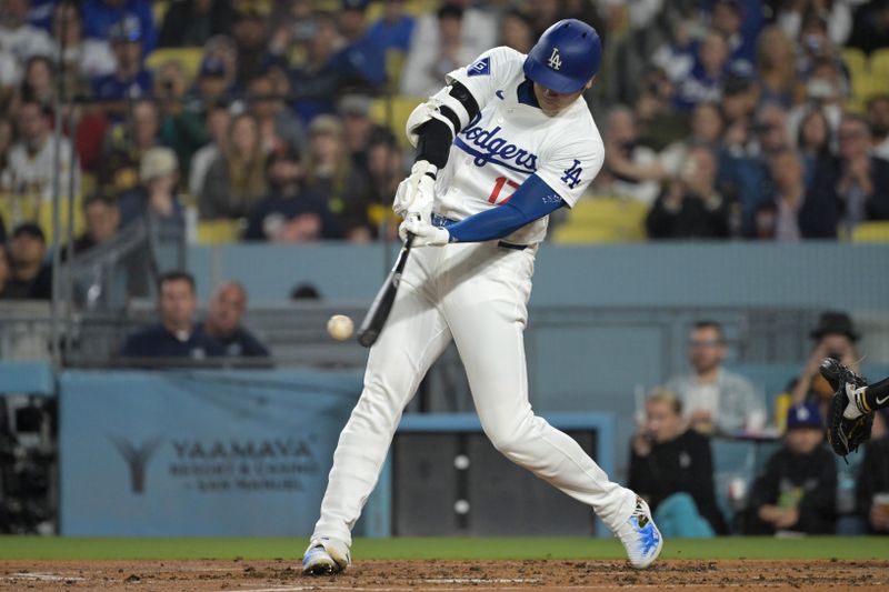 Sep 26, 2024; Los Angeles, California, USA;  Los Angeles Dodgers designated hitter Shohei Ohtani (17) fouls off a ball in the fourth inning against the San Diego Padres at Dodger Stadium. Mandatory Credit: Jayne Kamin-Oncea-Imagn Images