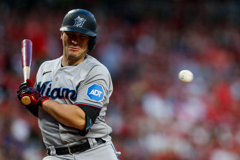 Aug 8, 2023; Cincinnati, Ohio, USA; Miami Marlins catcher Nick Fortes (4) gets hit by a pitch in the seventh inning against the Cincinnati Reds at Great American Ball Park. Mandatory Credit: Katie Stratman-USA TODAY Sports