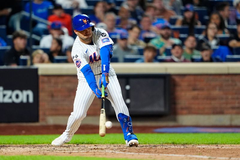 Sep 22, 2024; New York City, New York, USA; New York Mets second baseman Jose Iglesias (11) hits a single against the Philadelphia Phillies during the eighth inning at Citi Field. Mandatory Credit: Gregory Fisher-Imagn Images