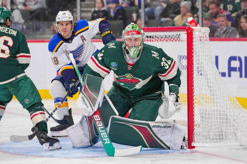 Nov 28, 2023; Saint Paul, Minnesota, USA; Minnesota Wild goaltender Filip Gustavsson (32) watches the puck against the St. Louis Blues in the third period at Xcel Energy Center. Mandatory Credit: Brad Rempel-USA TODAY Sports