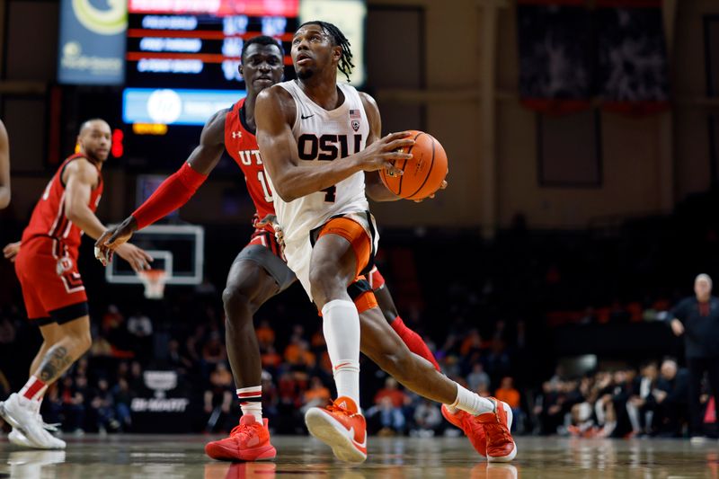 Jan 26, 2023; Corvallis, Oregon, USA; Oregon State Beavers guard Dexter Akanno (4, right) drives to the basket past Utah Utes center Keba Keita (13, behind) during the first half at Gill Coliseum. Mandatory Credit: Soobum Im-USA TODAY Sports