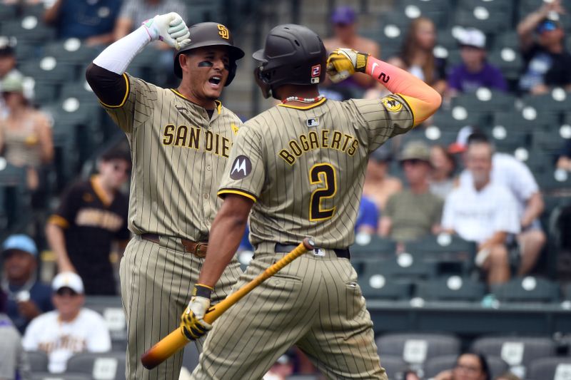 Aug 18, 2024; Denver, Colorado, USA; San Diego Padres third baseman Manny Machado (13) celebrates with designated hitter Xander Bogaerts (2) after a solo homerun in the eighth inning against the Colorado Rockies at Coors Field. Mandatory Credit: Christopher Hanewinckel-USA TODAY Sports