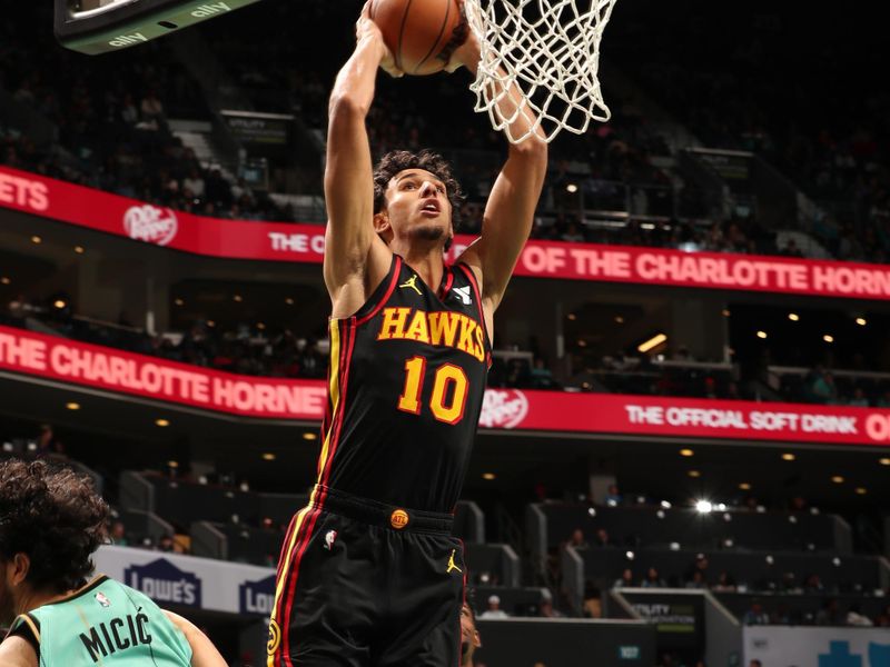 CHARLOTTE, NC - NOVEMBER 30: Zaccharie Risacher #10 of the Atlanta Hawks dunks the ball during the game against the Charlotte Hornets on November 30, 2024 at Spectrum Center in Charlotte, North Carolina. NOTE TO USER: User expressly acknowledges and agrees that, by downloading and or using this photograph, User is consenting to the terms and conditions of the Getty Images License Agreement. Mandatory Copyright Notice: Copyright 2024 NBAE (Photo by Kent Smith/NBAE via Getty Images)