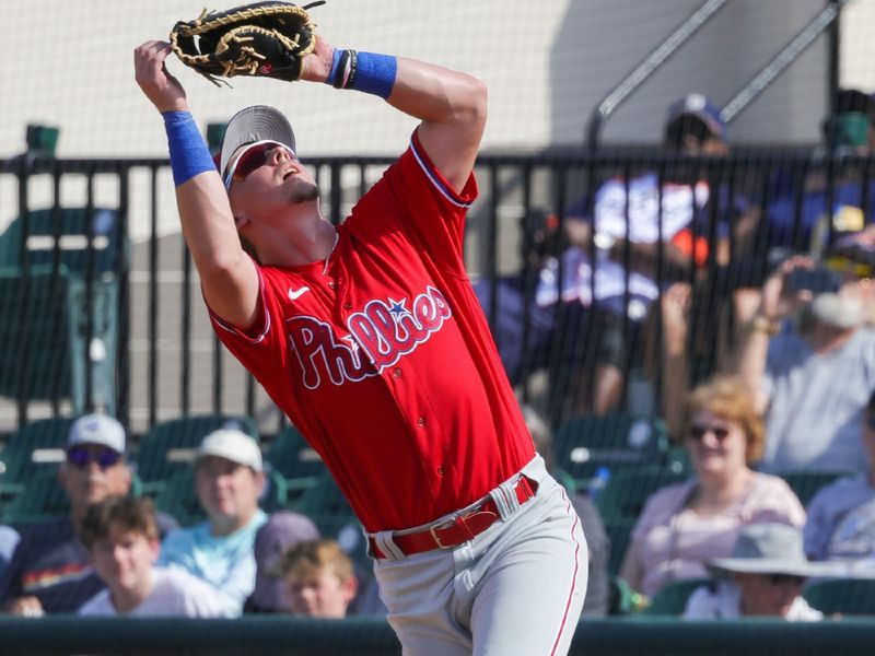 Feb 25, 2023; Lakeland, Florida, USA; Philadelphia Phillies first baseman Rhys Hoskins (17) chases a fly ball during the seventh inning against the Detroit Tigers at Publix Field at Joker Marchant Stadium. Mandatory Credit: Mike Watters-USA TODAY Sports