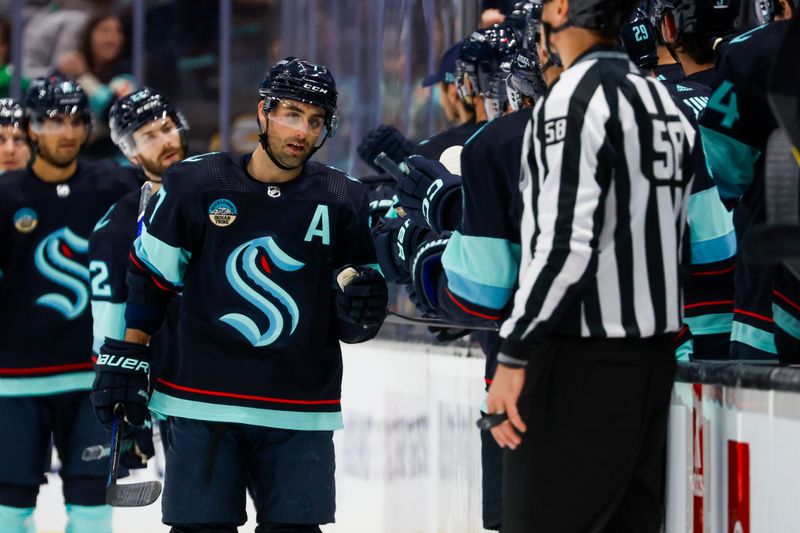 Feb 26, 2024; Seattle, Washington, USA; Seattle Kraken right wing Jordan Eberle (7) celebrates with teammates on the bench after scoring a power play goal against the Boston Bruins during the second period at Climate Pledge Arena. Mandatory Credit: Joe Nicholson-USA TODAY Sports