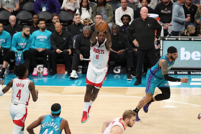 CHARLOTTE, NC - JANUARY 26:  Jae'Sean Tate #8 of the Houston Rockets grabs a rebound during the game against the Charlotte Hornets on January 26, 2024 at Spectrum Center in Charlotte, North Carolina. NOTE TO USER: User expressly acknowledges and agrees that, by downloading and or using this photograph, User is consenting to the terms and conditions of the Getty Images License Agreement.  Mandatory Copyright Notice:  Copyright 2024 NBAE (Photo by Brock Williams-Smith/NBAE via Getty Images)