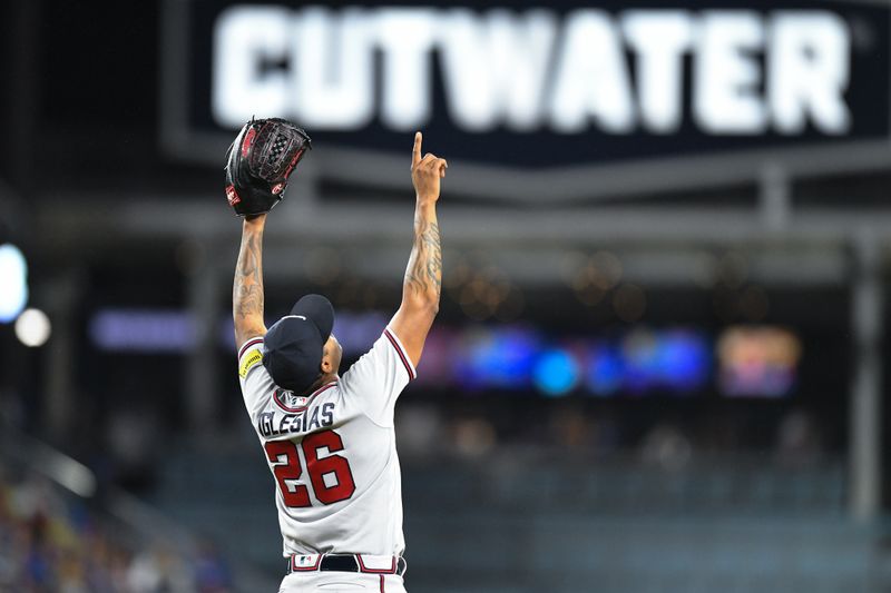 Sep 2, 2023; Los Angeles, California, USA; Atlanta Braves relief pitcher Raisel Iglesias (26) celebrates after defeating the Los Angeles Dodgers during the 10th inning at Dodger Stadium. Mandatory Credit: Jonathan Hui-USA TODAY Sports