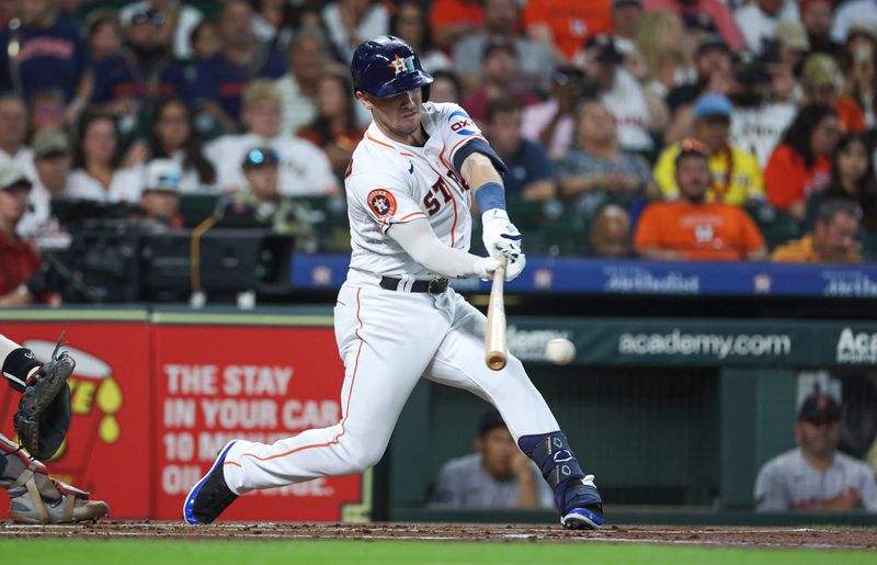 Aug 23, 2023; Houston, Texas, USA; Houston Astros third baseman Alex Bregman (2) hits a single during the first inning against the Boston Red Sox at Minute Maid Park. Mandatory Credit: Troy Taormina-USA TODAY Sports