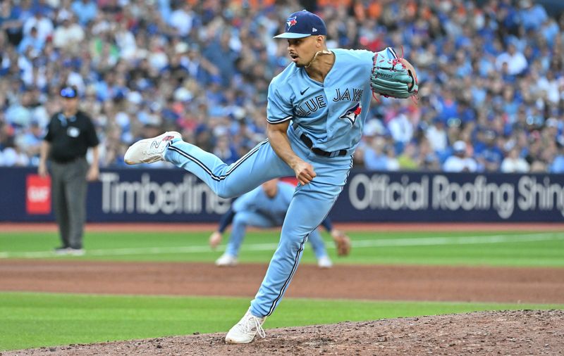 Sep 30, 2023; Toronto, Ontario, CAN;   Toronto Blue Jays relief pitcher Jordan Hicks (12) delivers a pitch against the Tamap Bay Rays in the ninth inning at Rogers Centre. Mandatory Credit: Dan Hamilton-USA TODAY Sports