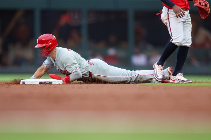 Jul 5, 2024; Atlanta, Georgia, USA; Philadelphia Phillies second baseman Whit Merrifield (9) steals second base against the Atlanta Braves in the second inning at Truist Park. Mandatory Credit: Brett Davis-USA TODAY Sports